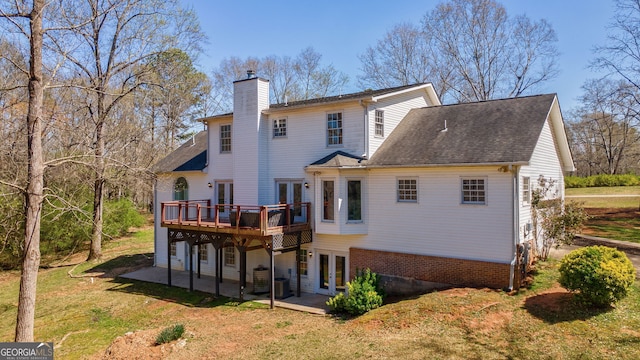 157 Riverbend Cir, Royston, GA 30662 - rear view of house with french doors, a chimney, a wooden deck, a lawn, and a patio area
