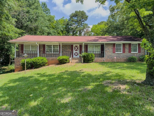 2000 Stone Mountain Lithonia Rd, Lithonia, GA 30058 - ranch-style house featuring a porch, a front yard, and brick siding