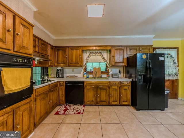 2000 Stone Mountain Lithonia Rd, Lithonia, GA 30058 - kitchen with black appliances, crown molding, brown cabinetry, and under cabinet range hood