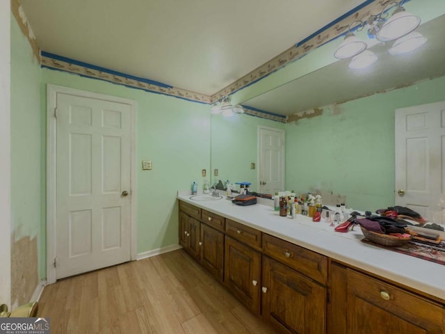 2000 Stone Mountain Lithonia Rd, Lithonia, GA 30058 - full bathroom featuring wood finished floors, double vanity, and baseboards