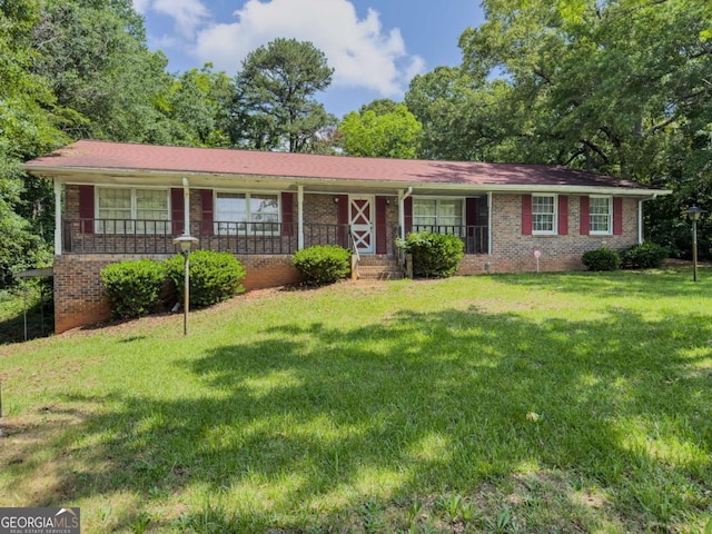 2000 Stone Mountain Lithonia Rd, Lithonia, GA 30058 - single story home with a porch, brick siding, and a front yard