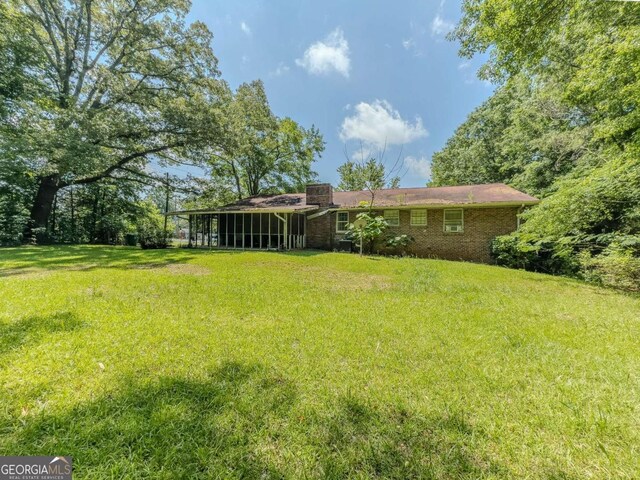 2000 Stone Mountain Lithonia Rd, Lithonia, GA 30058 - view of green lawn featuring a sunroom