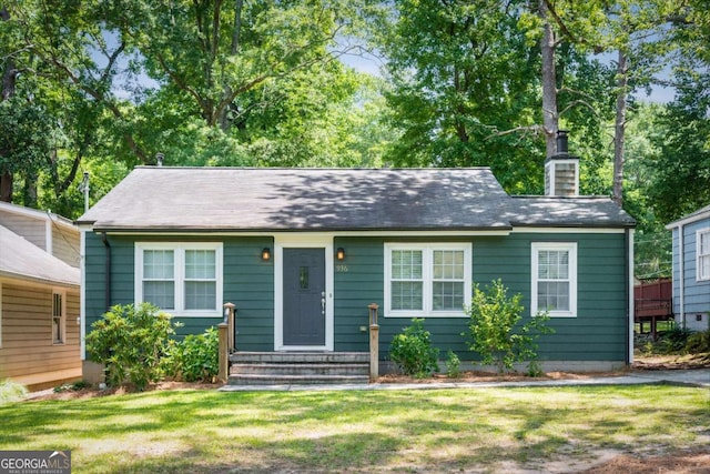 936 Ormewood Ter SE, Atlanta, GA 30316 - view of front of home featuring a chimney and a front yard