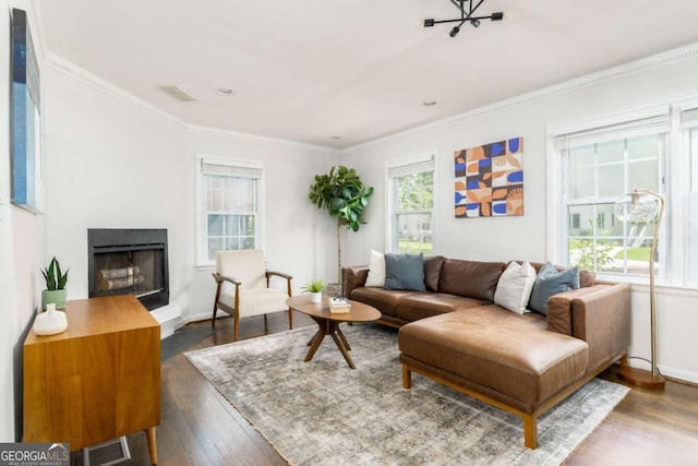 936 Ormewood Ter SE, Atlanta, GA 30316 - living area featuring wood finished floors, a fireplace, crown molding, and baseboards