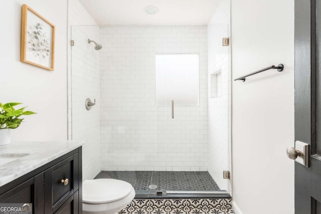 936 Ormewood Ter SE, Atlanta, GA 30316 - bathroom featuring vanity, a stall shower, and toilet