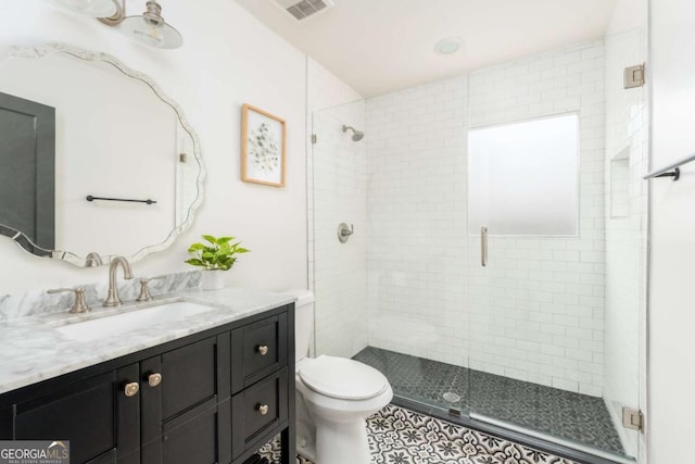 936 Ormewood Ter SE, Atlanta, GA 30316 - bathroom with vanity, a shower stall, and toilet