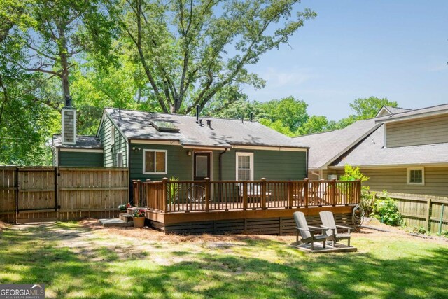 936 Ormewood Ter SE, Atlanta, GA 30316 - back of house featuring a wooden deck, a shingled roof, and a chimney