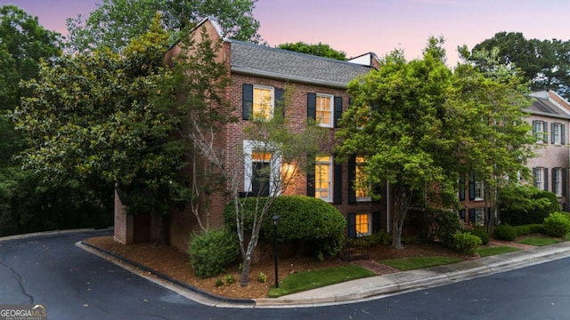 3532 Paces Pl NW, Atlanta, GA 30327 - georgian-style home with brick siding and roof with shingles