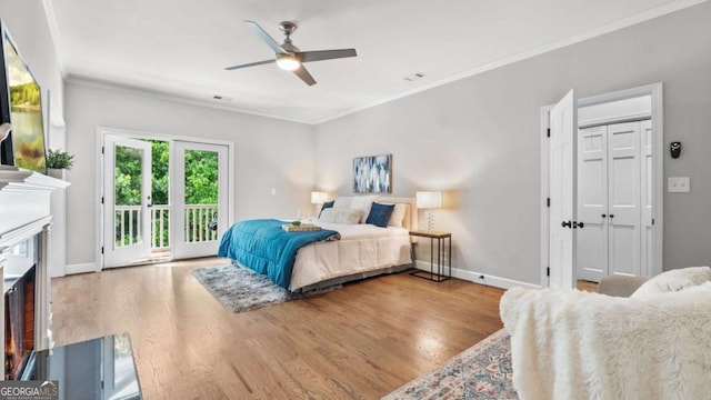 3532 Paces Pl NW, Atlanta, GA 30327 - bedroom with access to outside, crown molding, wood finished floors, ceiling fan, and a fireplace