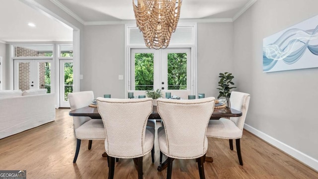 3532 Paces Pl NW, Atlanta, GA 30327 - dining space with french doors, a chandelier, wood finished floors, and crown molding
