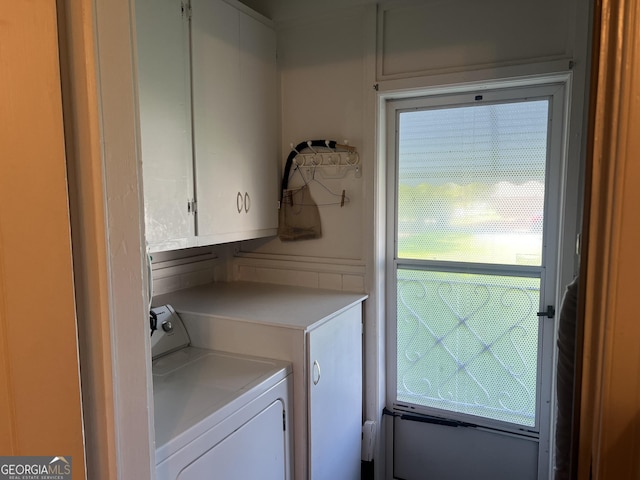 608 4th Ave SW, Thomaston, GA 30286 - washroom with cabinet space and washer / clothes dryer