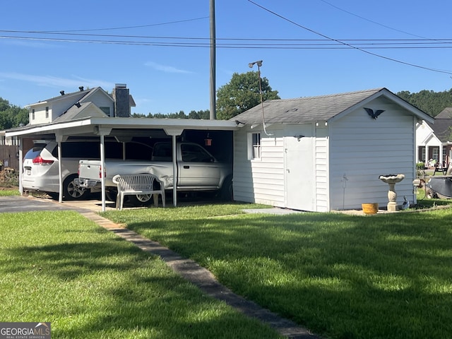 608 4th Ave SW, Thomaston, GA 30286 - view of side of property with a lawn, a carport, and a chimney