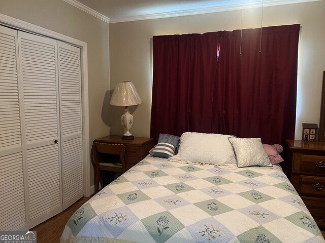 608 4th Ave SW, Thomaston, GA 30286 - bedroom with ornamental molding, wood finished floors, and a closet