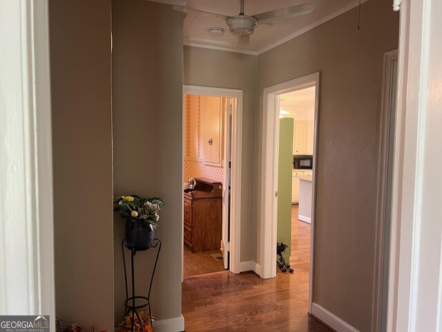 608 4th Ave SW, Thomaston, GA 30286 - hallway featuring wood finished floors, crown molding, and baseboards