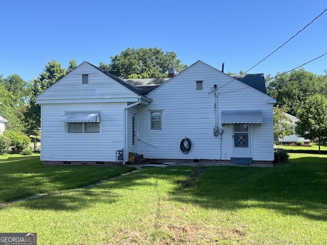 608 4th Ave SW, Thomaston, GA 30286 - rear view of property featuring entry steps, a lawn, and crawl space