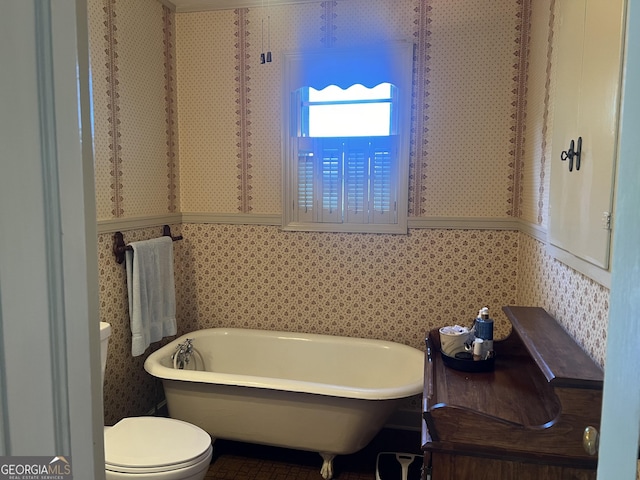 608 4th Ave SW, Thomaston, GA 30286 - bathroom featuring a freestanding bath and toilet