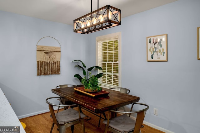 1445 Monroe Dr NE Unit C13, Atlanta, GA 30324 - dining area featuring a chandelier and wood finished floors