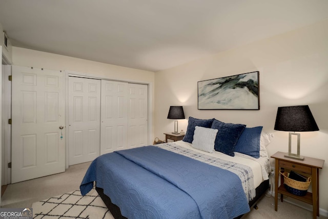 1445 Monroe Dr NE Unit C13, Atlanta, GA 30324 - bedroom with light colored carpet and a closet
