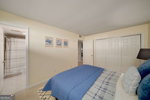 1445 Monroe Dr NE Unit C13, Atlanta, GA 30324 - bedroom featuring a closet and ensuite bathroom