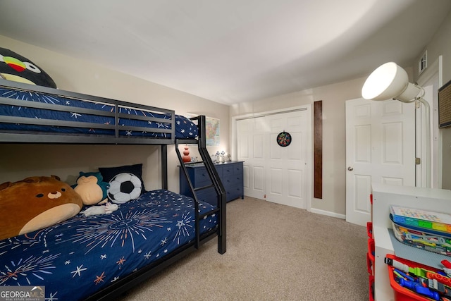 1445 Monroe Dr NE Unit C13, Atlanta, GA 30324 - bedroom featuring carpet flooring and a closet