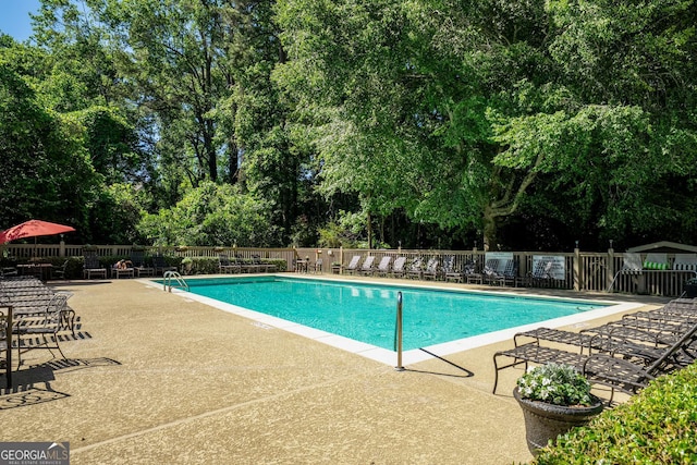 1445 Monroe Dr NE Unit C13, Atlanta, GA 30324 - community pool with a patio area and view of scattered trees