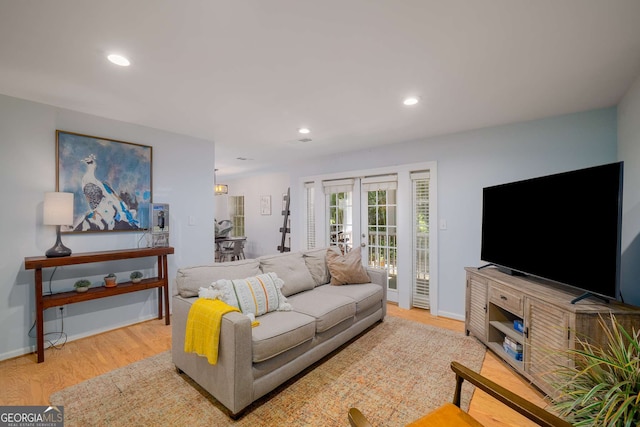 1445 Monroe Dr NE Unit C13, Atlanta, GA 30324 - living room featuring wood finished floors, french doors, and recessed lighting