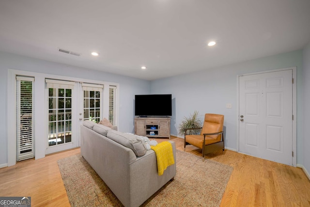 1445 Monroe Dr NE Unit C13, Atlanta, GA 30324 - living area featuring french doors, light wood-style flooring, and recessed lighting