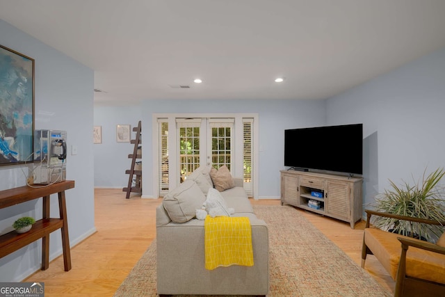 1445 Monroe Dr NE Unit C13, Atlanta, GA 30324 - living room featuring french doors, light wood-style flooring, and recessed lighting