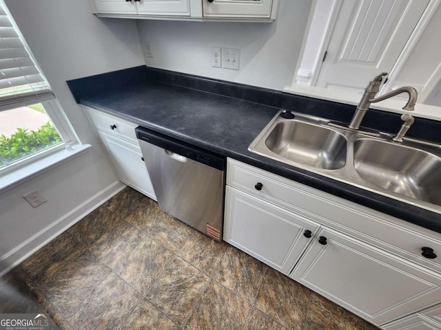 206 York Way, Augusta, GA 30909 - kitchen featuring stainless steel dishwasher, a sink, dark countertops, white cabinetry, and dark stone finish flooring