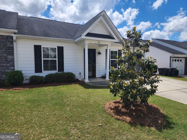 206 York Way, Augusta, GA 30909 - view of front of home featuring a front yard, driveway, roof with shingles, and a garage