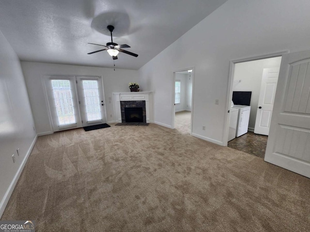 206 York Way, Augusta, GA 30909 - unfurnished living room featuring washing machine and clothes dryer, carpet, baseboards, ceiling fan, and high vaulted ceiling
