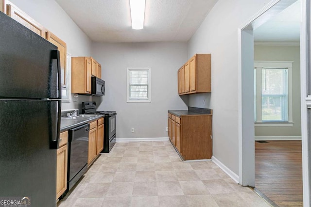 3361 Myrtle St, Atlanta, GA 30354 - kitchen featuring black appliances, dark countertops, and crown molding