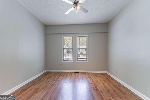 3361 Myrtle St, Atlanta, GA 30354 - unfurnished room with wood finished floors, a ceiling fan, and a textured ceiling
