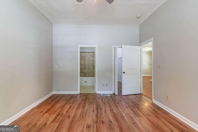 3361 Myrtle St, Atlanta, GA 30354 - unfurnished bedroom with wood finished floors, ensuite bathroom, and a ceiling fan