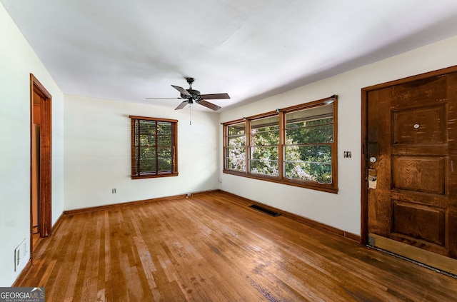 511 Oakview Rd, Decatur, GA 30030 - empty room with wood finished floors, ceiling fan, and baseboards