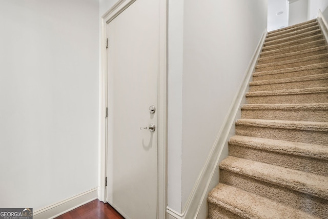 1199 Lavista Rd NE, Atlanta, GA 30324 - stairway with wood finished floors and baseboards