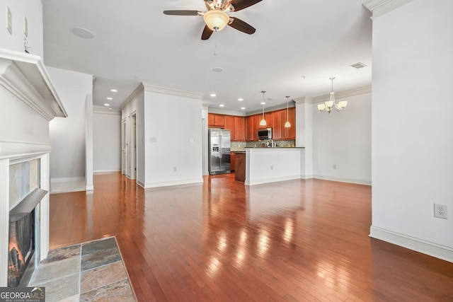 1199 Lavista Rd NE, Atlanta, GA 30324 - unfurnished living room with a fireplace, ceiling fan, a chandelier, ornamental molding, and light wood finished floors