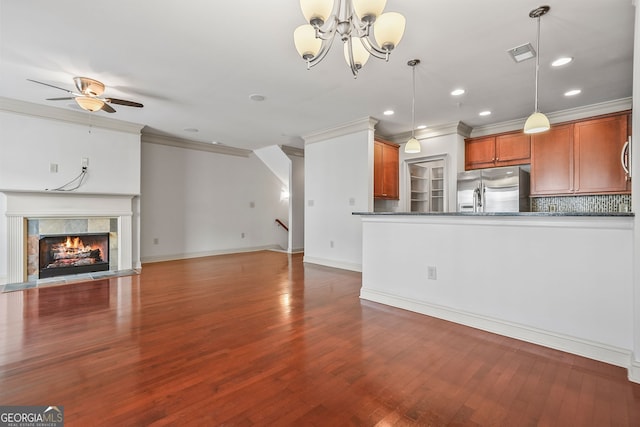 1199 Lavista Rd NE, Atlanta, GA 30324 - unfurnished living room with crown molding, wood finished floors, a chandelier, ceiling fan, and a tiled fireplace