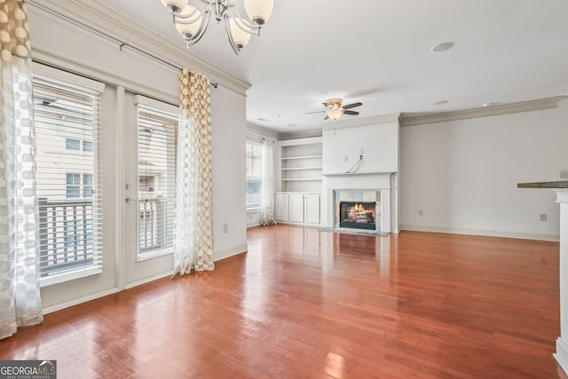 1199 Lavista Rd NE, Atlanta, GA 30324 - unfurnished living room with a tiled fireplace, a chandelier, wood finished floors, ornamental molding, and a ceiling fan