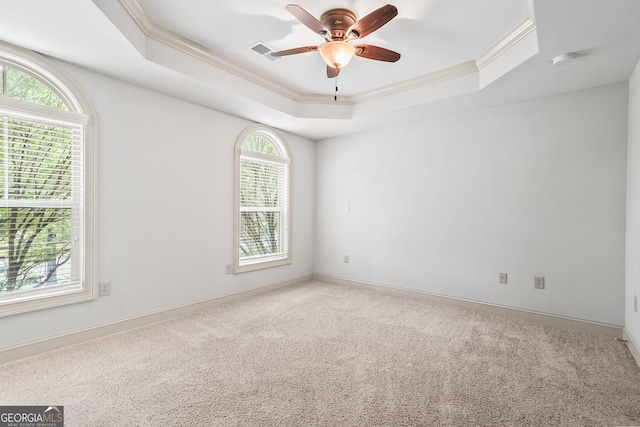 1199 Lavista Rd NE, Atlanta, GA 30324 - spare room with a tray ceiling, crown molding, healthy amount of natural light, a ceiling fan, and a smoke detector
