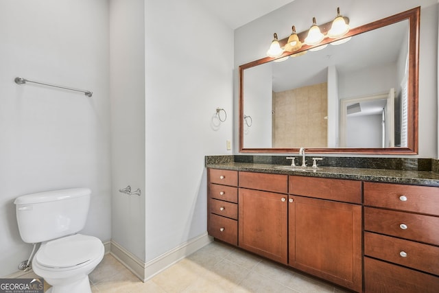 1199 Lavista Rd NE, Atlanta, GA 30324 - full bathroom with toilet, vanity, baseboards, and tile patterned floors