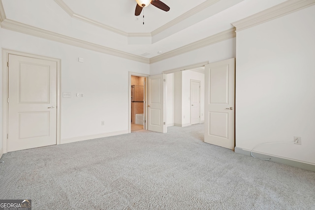 1199 Lavista Rd NE, Atlanta, GA 30324 - unfurnished bedroom featuring light colored carpet, ornamental molding, a raised ceiling, baseboards, and a ceiling fan