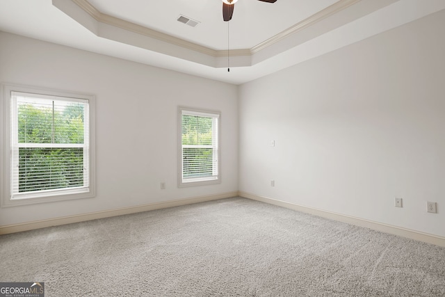 1199 Lavista Rd NE, Atlanta, GA 30324 - carpeted spare room featuring crown molding, a tray ceiling, and a ceiling fan