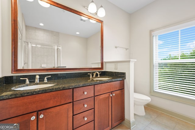 1199 Lavista Rd NE, Atlanta, GA 30324 - bathroom with healthy amount of natural light, toilet, a stall shower, and double vanity