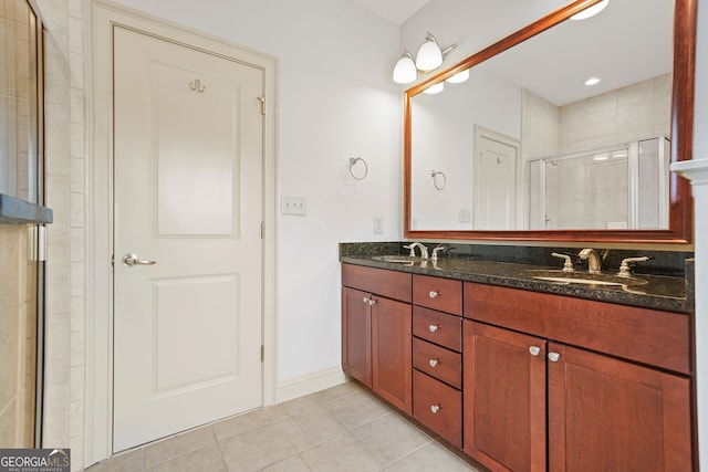 1199 Lavista Rd NE, Atlanta, GA 30324 - bathroom with tile patterned floors, double vanity, and a shower stall
