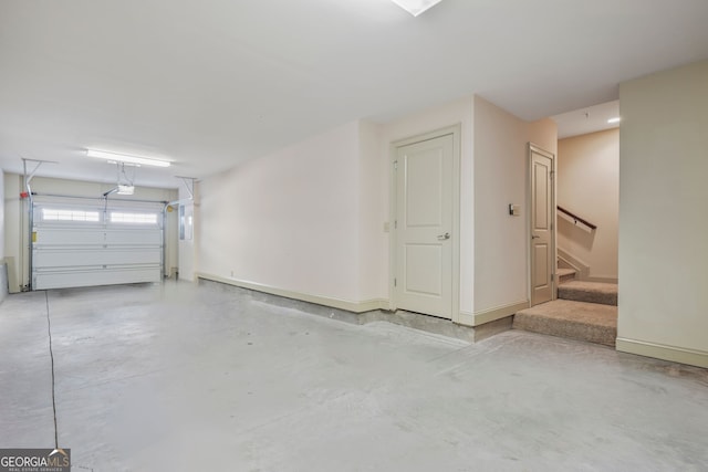 1199 Lavista Rd NE, Atlanta, GA 30324 - garage featuring baseboards and a garage door opener