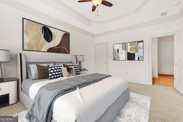 1199 Lavista Rd NE, Atlanta, GA 30324 - bedroom with carpet floors, crown molding, a raised ceiling, and a ceiling fan