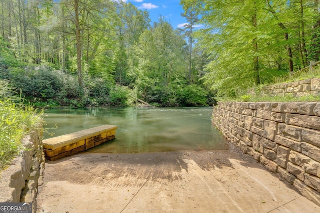 76 River Forest Pl Unit D, Suches, GA 30572 - dock area featuring a boat ramp, a water view, and a forest view