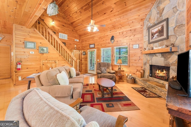 76 River Forest Pl Unit D, Suches, GA 30572 - living room featuring stairway, wood finished floors, wood ceiling, a stone fireplace, and ceiling fan