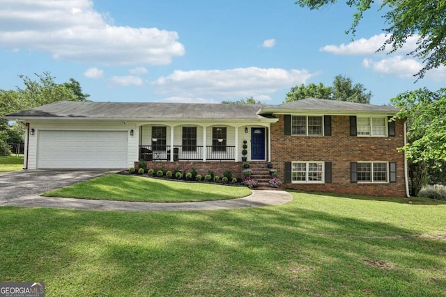 156 Sims St, Winder, GA 30680 - split level home with driveway, a garage, a front yard, and covered porch